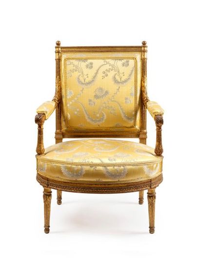 null Large armchair with a flat back in moulded, carved and gilded wood, the rounded...