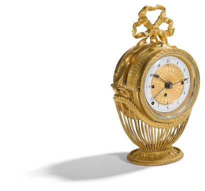 null Rare small double-sided gilt bronze clock forming an alarm clock, with a dial...