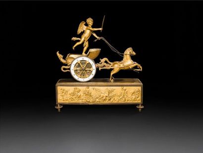 null Gilt bronze clock with the chariot of Love, pulled by two horses, the dial with...