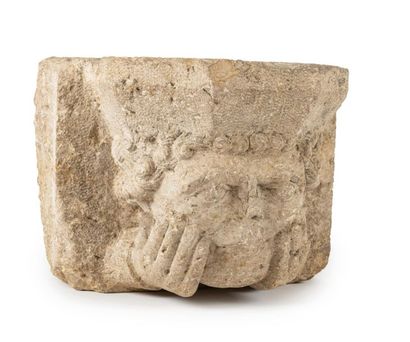 null Limestone corbel carved with a curly-haired man's head resting on his hands.
14th...