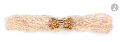 null Multi-row necklace of cultured pearls adorned with an 18K (750) gold cord clasp...