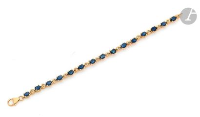 null 18K (750) gold bracelet articulated with oval-shaped sapphires set with round...