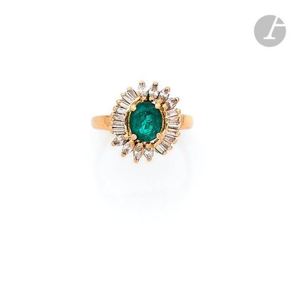 null 18K (750) gold ring set with an oval emerald weighing 1.77 ct surrounded by...