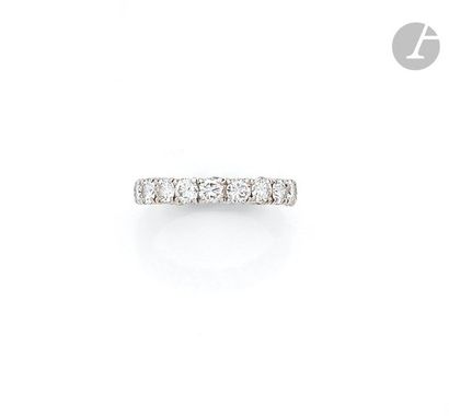 null American platinum wedding band, entirely set with round brilliant diamonds....