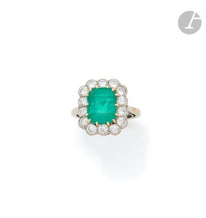 null Ring in 18K (750) white gold, set with a quadrangular shaped cut emerald surrounded...