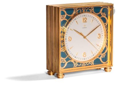 null OMEGA clock. Circa 1950Gilt
metal clock, white dial, Arabic numeral hour markers...