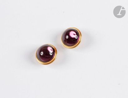 null LALIC. Pair of gold metal ear clips set with purple crystal cabochons. Sign...