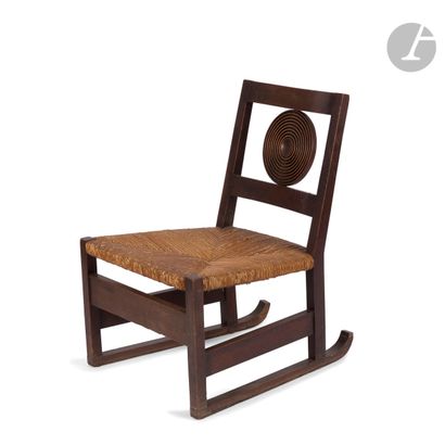 null VICTOR COURTRAY (1896-1987) 
Fireside chair on ski legs. Stained oak shaft....