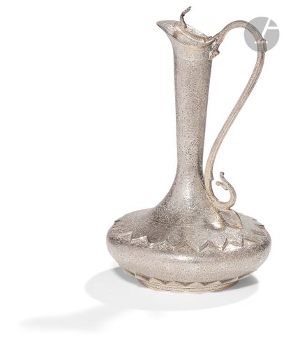  Silver ewer, India, Kashmir, late 19th centurySilver ewer with a crushed body topped...