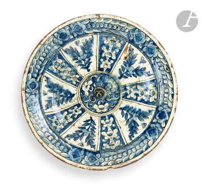 null 
A tabak dish with radiating blue and white decoration, Ottoman Turkey, Iznik,...