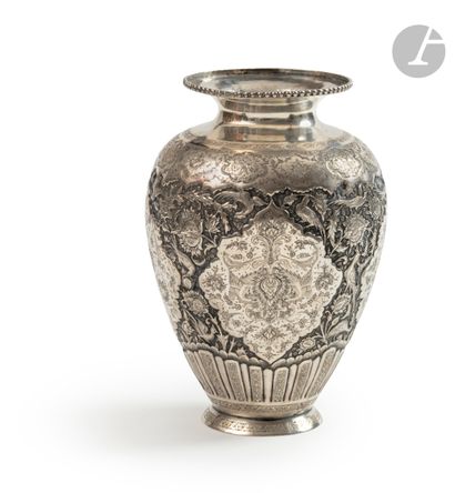null A high silver vase, Iran, Isfahan, 20th centuryAn
ovoid
bowl
set on a truncated...
