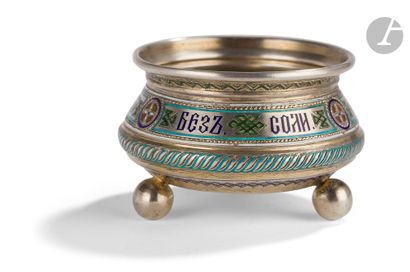 null Silver and champlevé enamel tripod salt cellar. 1882The
belt is decorated in...