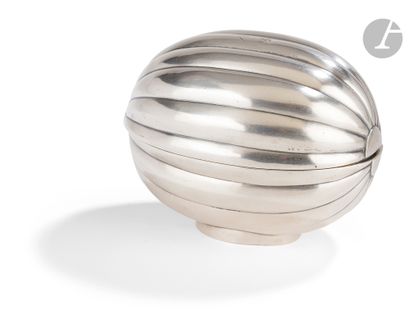  Silver box in the shape of a watermelon with ribsIn two parts, resting on a simple...