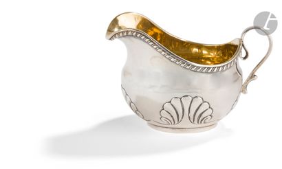  Silver creamer. 1819-1826Body decorated with shells. The neck is underlined by a...