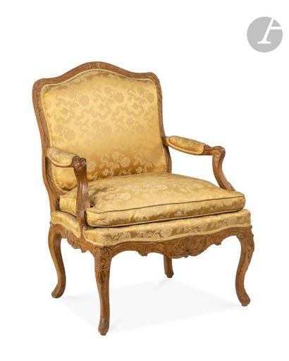 null A carved beechwood armchair with a flat back decorated with rocaille, shells,...