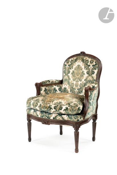 null A stained wood armchair with a rounded back and flower decoration, resting on...