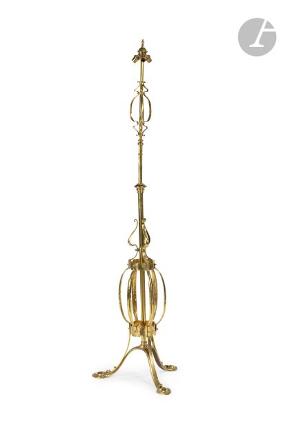 null Brass floor lamp, the openwork shaft resting on a tripod base.
20th century.
H...