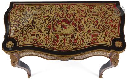 null A red tortoiseshell and brass marquetry game table with a folding top decorated...