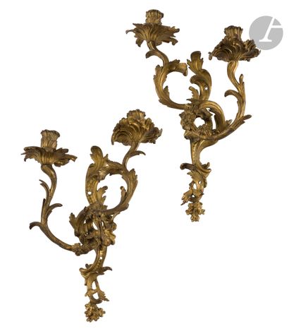 null A pair of ormolu sconces with two lights (pierced for electricity).
Louis XV...