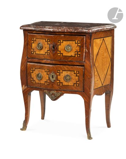 null A walnut and ash burr chest of drawers, opening to two drawers, the top of Griotte...