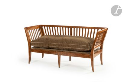 null Stained walnut sofa, the back and sides with bars, resting on sheath feet.
Late...