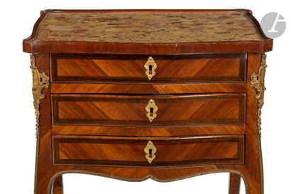 null A small satinwood and amaranth table (all sides) with three drawers in front...