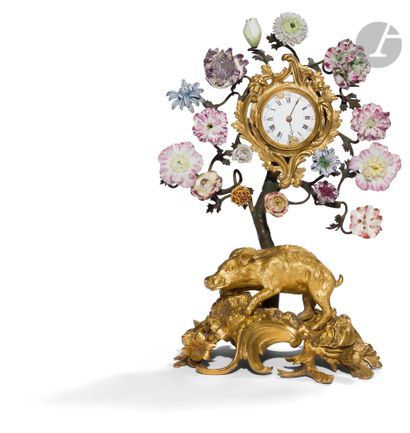 null An ormolu boar clock, the dial with Roman numerals (chips) decorated with foliage...