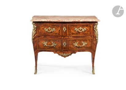 null A rosewood chest of drawers with two drawers, the Trets marble top resting on...