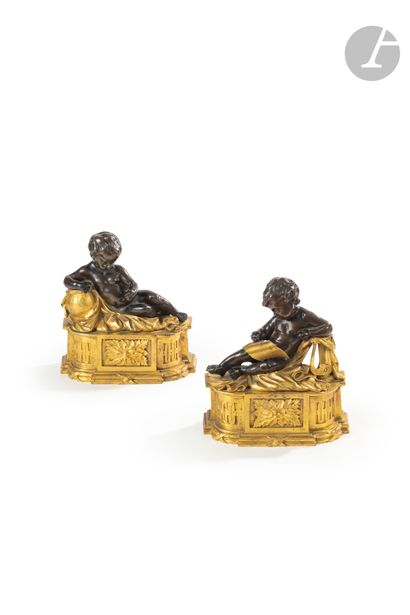 null A pair of patinated and gilt bronze andirons decorated with allegorical figures...