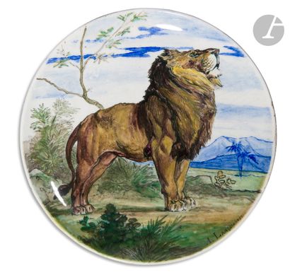 null Théodore Deck
Plat rond en faïence à décor polychrome d’un lion mâle dans un...