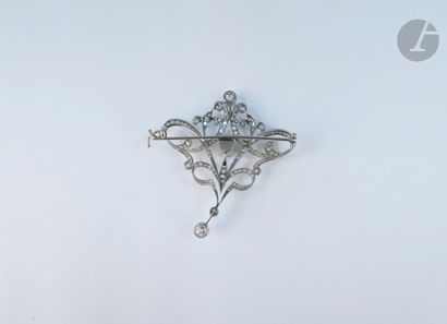 null A platinum flower brooch, entirely set with rose-cut diamonds, set with two...