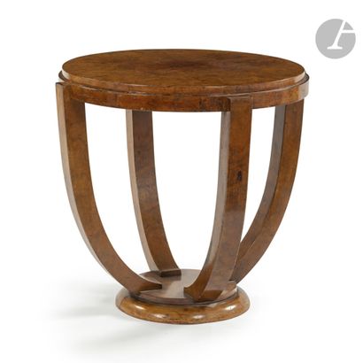 null WORK OF THE 1930'
sBurple veneer
pedestal table.
The base with one step receives...