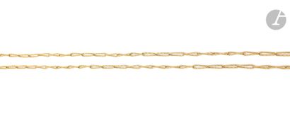null Long necklace in 18K (750) gold, articulated with slightly twisted elongated...