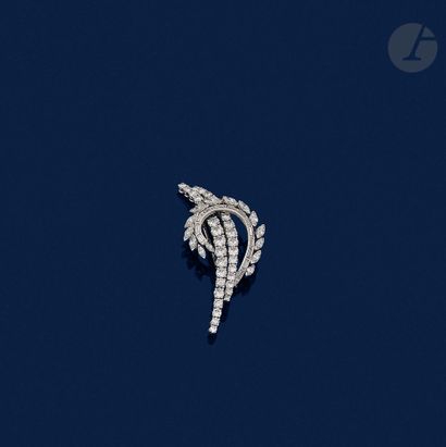 null A platinum spray brooch set with round brilliant-cut diamonds, calibrated and...