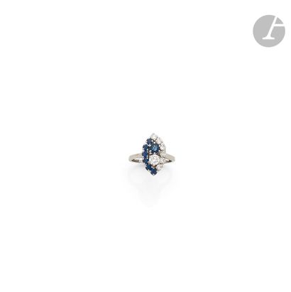 null Platinum navette ring set with round brilliant-cut diamonds and round sapphires....