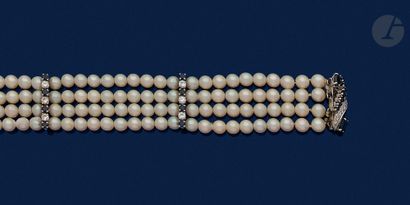 null Bracelet with 4 rows of cultured pearls set with round brilliant-cut diamonds...