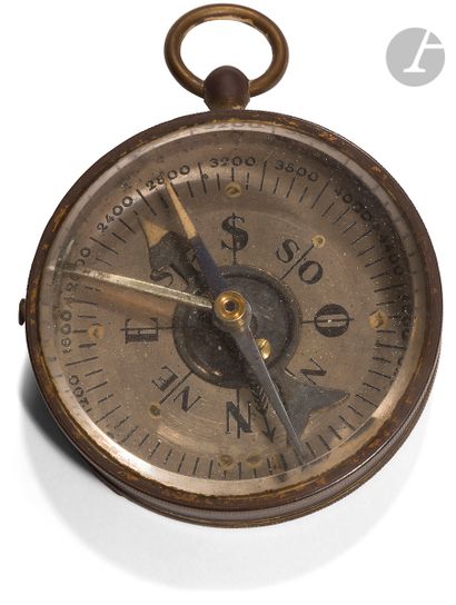 null Small brass compass with locking system. The dial has 8 directions and is numbered...