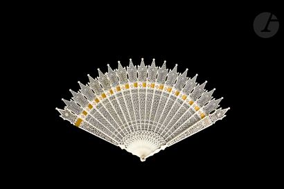 null Ivory lace, France, circa 1800-1820
Broken type ivory fan* very finely cut with...