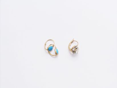 null A pair of 18K (750) gold sleeper earrings, each with a cabochon turquoise. French...