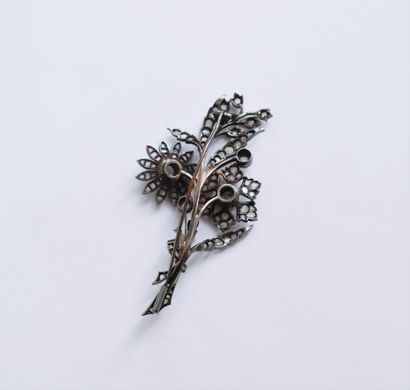 null Silver brooch forming a floral motif set with rose-cut diamonds. Work of the...