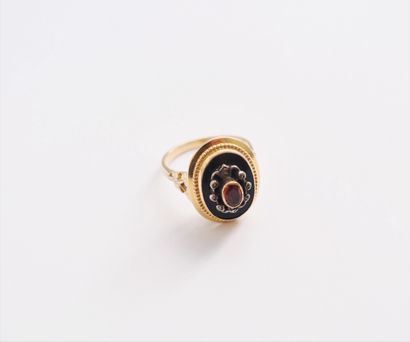 null A silver and 18K (750) gold ring set with an orange stone surrounded by rose-cut...