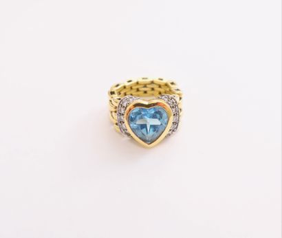 null 18K (750) gold ring with a heart-shaped blue stone set with round brilliant-cut...