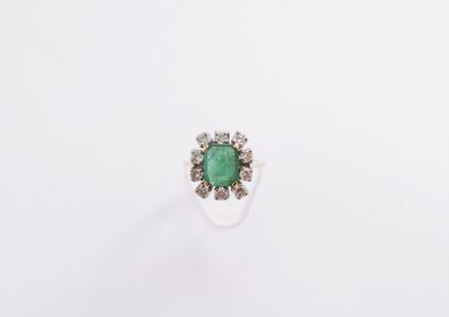 null 18K (750) white gold ring, set with an octagonal emerald surrounded by round...