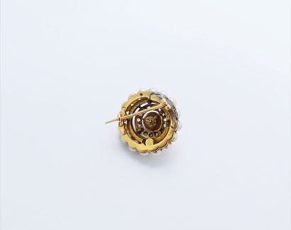 null 
18K (750) gold brooch, set with a pearl, probably fine, surrounded by rose-cut...
