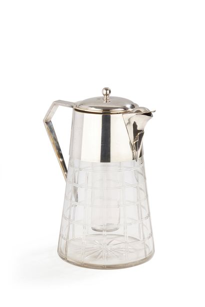 null CIRCA
1930Metal and cut glass orangeade
jug
, truncated cone shape, complete...