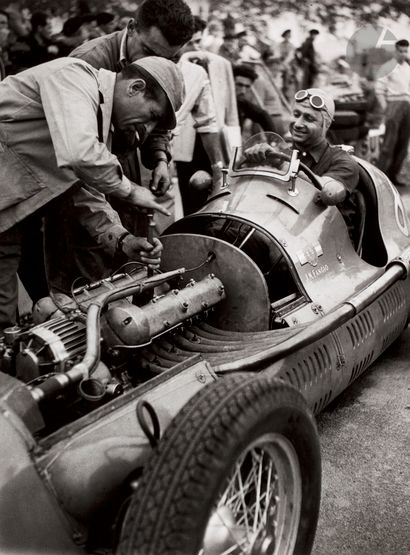 null Jean Dieuzaide (1921 - 2003) 
Fangio waits for his mechanics tuning his Maserati...