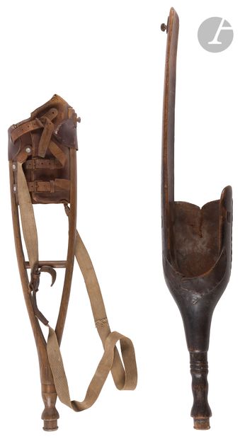 Two wooden legs, wood and leather prosthesis:...