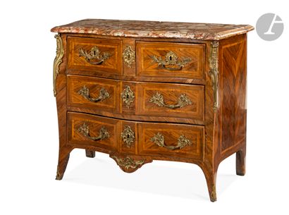 A rosewood chest of drawers with four drawers,...