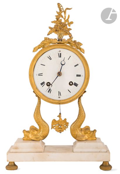 null White marble and gilt bronze clock, the dial with Roman numerals surmounted...