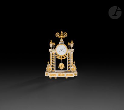 null A white marble, black marble and ormolu clock of portico form, decorated with...